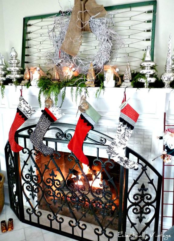 Crib spring Christmas mantel - love this festive look!  kellyelko.com