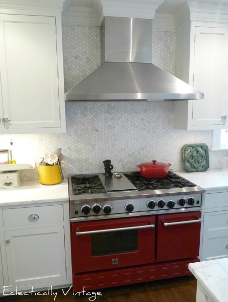 Red oven - focal point in this white cottage kitchen.  kellyelko.com