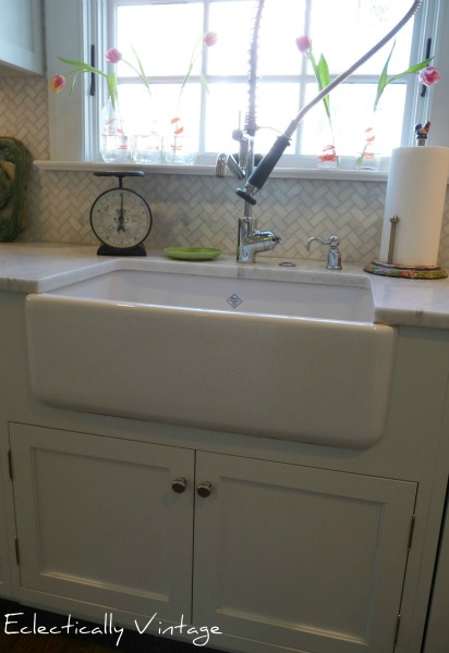 Shaws farmhouse sink - fabulous in this white kitchen.  kellyelko.com