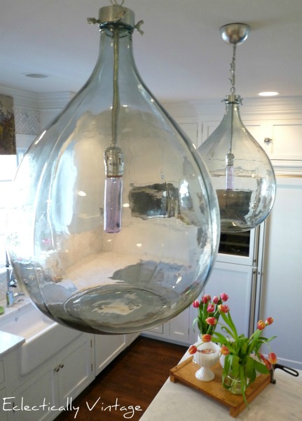 Stunning demijohn glass pendant lights in this amazing kitchen.  kellyelko.com