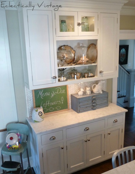 Open kitchen shelving built in in a gorgeous white kitchen with attention to detail.  kellyelko.com