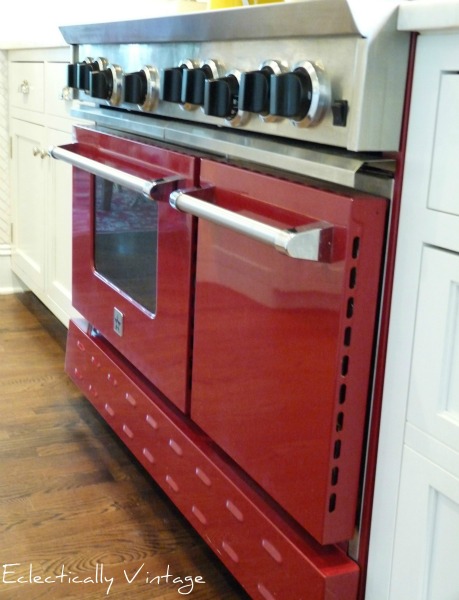 Red BlueStar stove - this is a showstopper in this white kitchen.  kellyelko.com