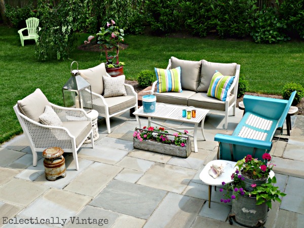 Eclectic patio - love the mixture of new and vintage pieces and the creative planters!  kellyelko.com