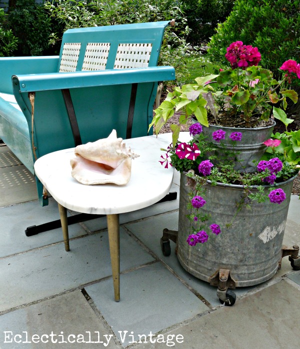 Eclectic patio - love the mixture of new and vintage pieces and the creative planters!  kellyelko.com