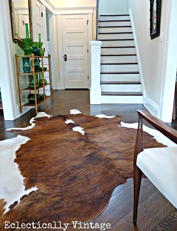 Fabulous foyer ideas - love the rug, collections and lighting!  kellyelko.com