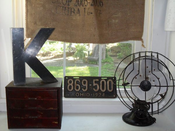 She has the best vintage finds and knows how to show them off - love the old fan! kellyelko.com