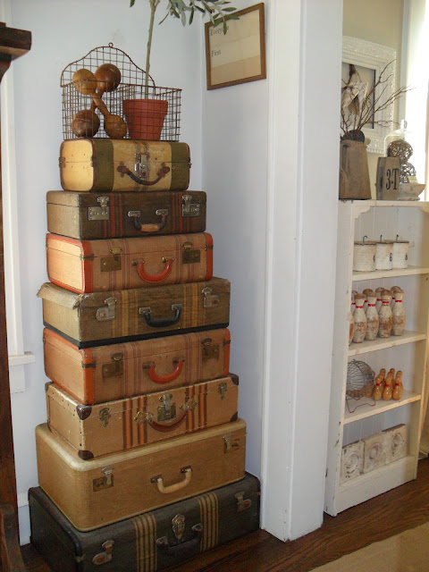 Vintage suitcase collection - she knows how to display the best vintage finds! kellyelko.com