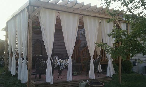 Love this pergola with the curtains for privacy - so pretty! kellyelko.com