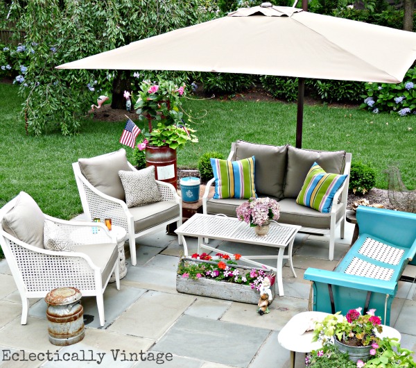 Eclectic outdoor patio - love the vintage blue glider kellyelko.com