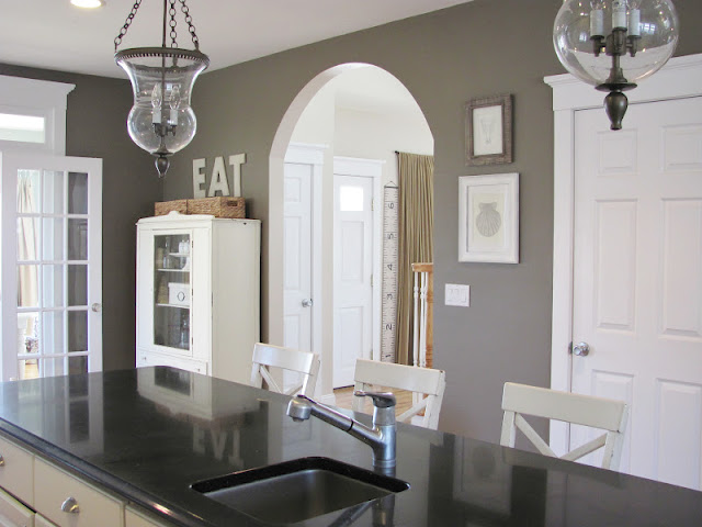 Farmhouse kitchen - love the paint color and two glass pendant lights kellyelko.com