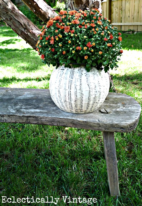 DIY Halloween music sheet planter from a plastic pumpkin!  Perfect fall decorations at kellyelko.com