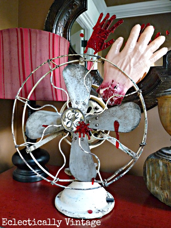 Halloween House Tour - tons of creative #Halloween decorations like this severed hand fan!  kellyelko.com