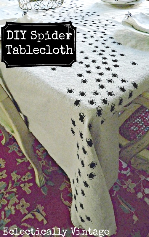 Halloween Crafts - Make this DIY Swarming Spiders Tablecloth - be the hit of your dinner party! kellyelko.com #halloween #halloweencrafts #crafts #spiders #stencil #stencilcrafts #diyideas #halloweendecor #spiders #halloweenparty #halloweentable