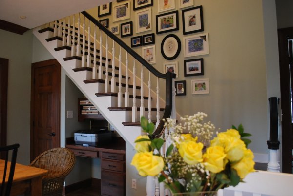 Stairway Gallery Wall - love the mix of frames, art and photos