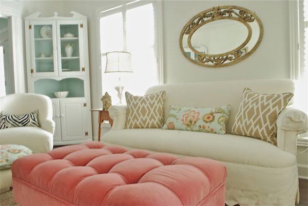 Creative Chaos Living Room - love the pink ottoman!