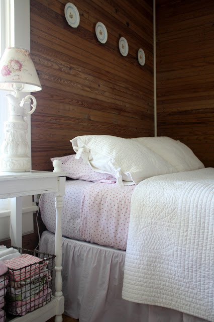 Farmhouse bedroom - love the wood walls