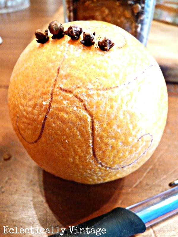 Make an orange pomander - great for the holidays (and smells divine)!  kellyelko.com