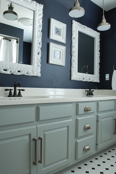 Bold Bathroom - love the dark walls with the white frames