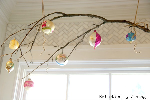 Christmas House Tours - step inside this 100 year old home filled with tons of fabulous decorating ideas like this branch window treatment!  kellyelko.com