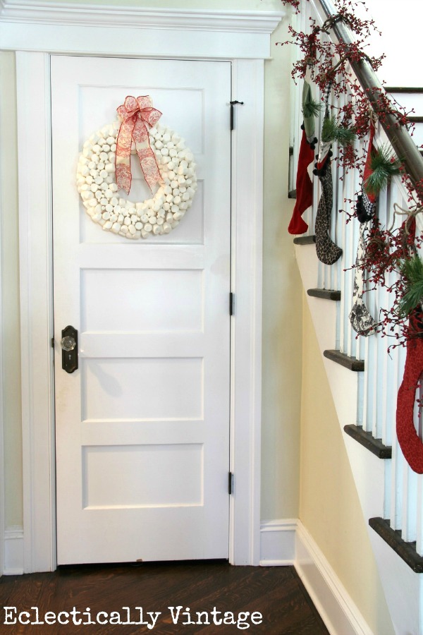 Love the bannister with Christmas stockings and that marshmallow wreath she made! kellyelko.com