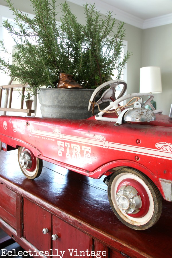 Christmas House Tours - step inside this 100 year old home filled with tons of fabulous decorating ideas like this vintage fire truck!  kellyelko.com