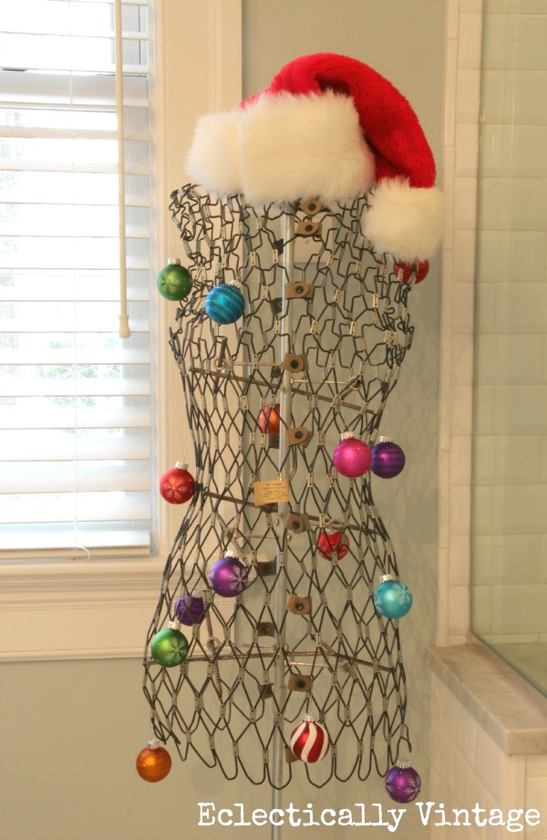 Christmas House Tours - step inside this 100 year old home filled with tons of fabulous decorating ideas like this vintage dress form!  kellyelko.com