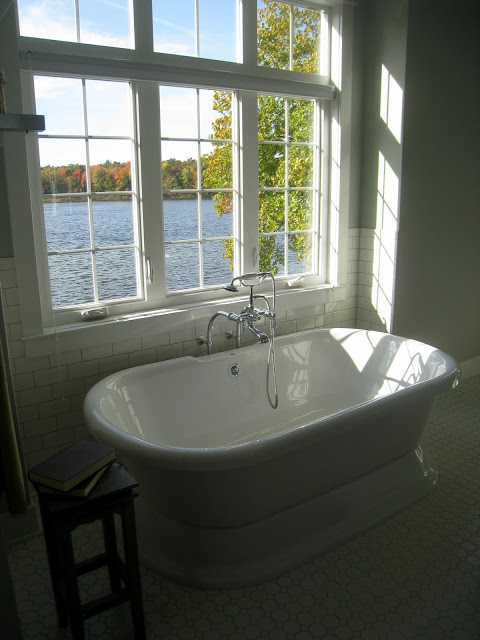 Gorgeous white #bathroom - part of this lake house home kellyelko.com