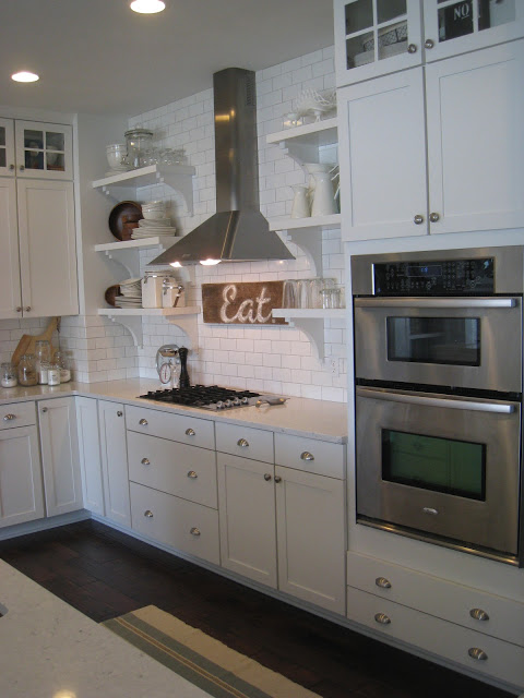 Gorgeous white #kitchen - part of this lake house home kellyelko.com