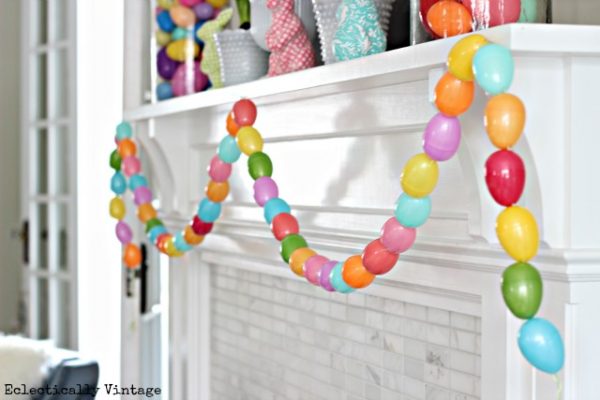 Fun spring mantel with the cutest DIY egg garland! eclecticallyvitnage.com #spring #springcrafts #easter #eastercrafts #kidscrafts #crafting #crafts #diyideas #diyprojects #springmantel #springdecor