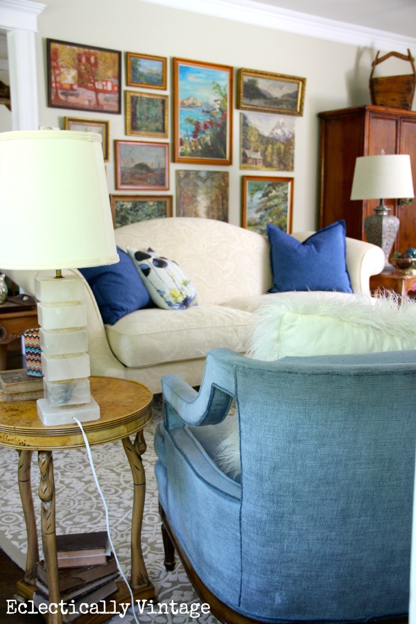 Eclectic living room - love that vintage landscape gallery wall