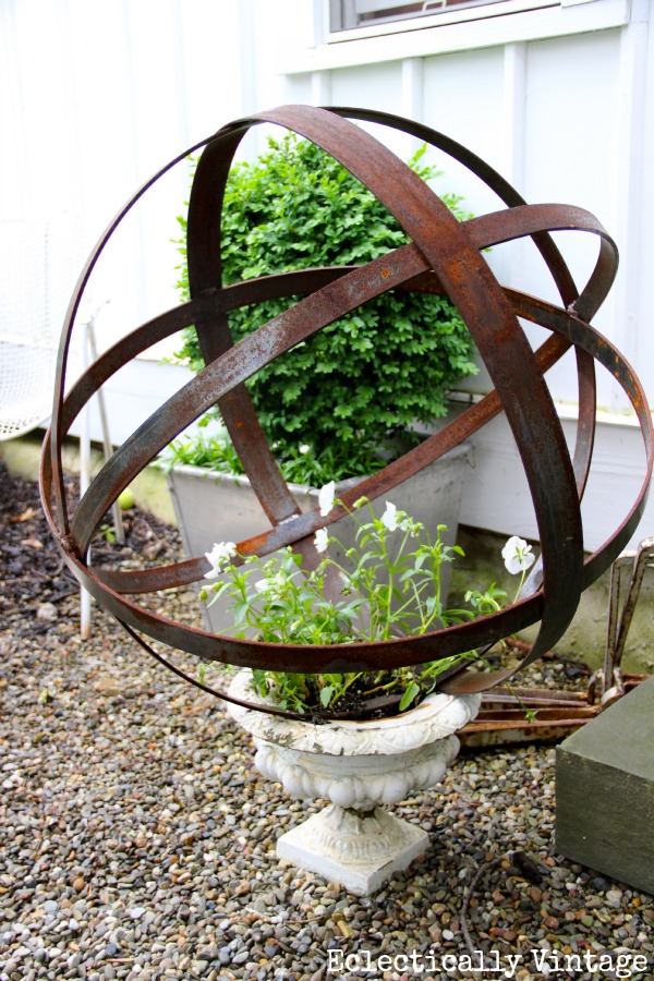 Stunning garden - love the orb in the urn kellyelko.com