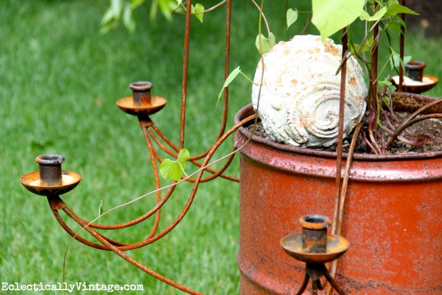 Get creative - giant candle holder as garden trellis.  One of many unique planters at kellyelko.com