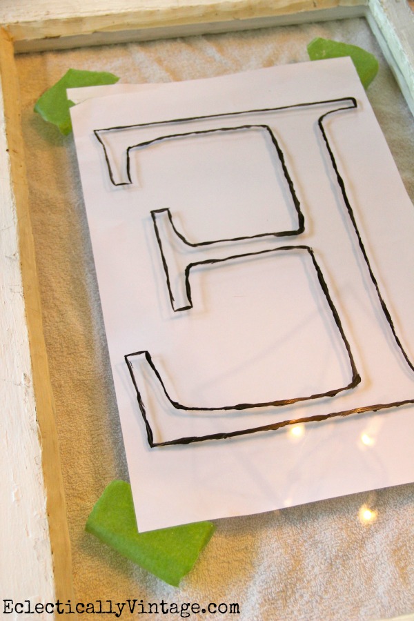 DIY Monogram Antique Window - simple way to make your own monogram on any piece of glass. kellyelko.com