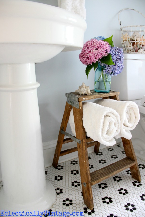 Cute towel storage in this fabulous bathroom!  kellyelko.com