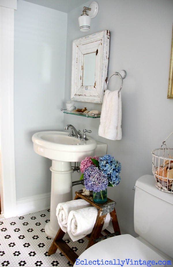 Vintage bathroom - love the floor and color (and that cute ladder)!  kellyelko.com