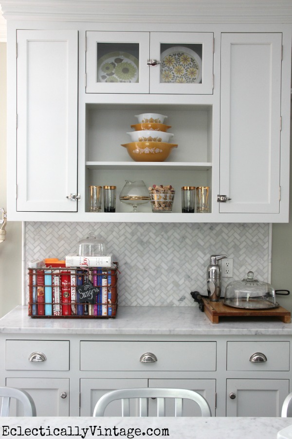 White kitchen - love the open shelves and the fun collections.  kellyelko.com