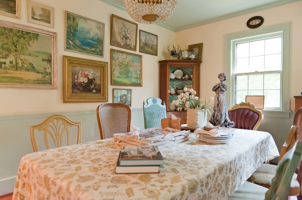 The Decorologist Dining Room - love the mis matched chairs and vintage landscape wall.  kellyelko.com