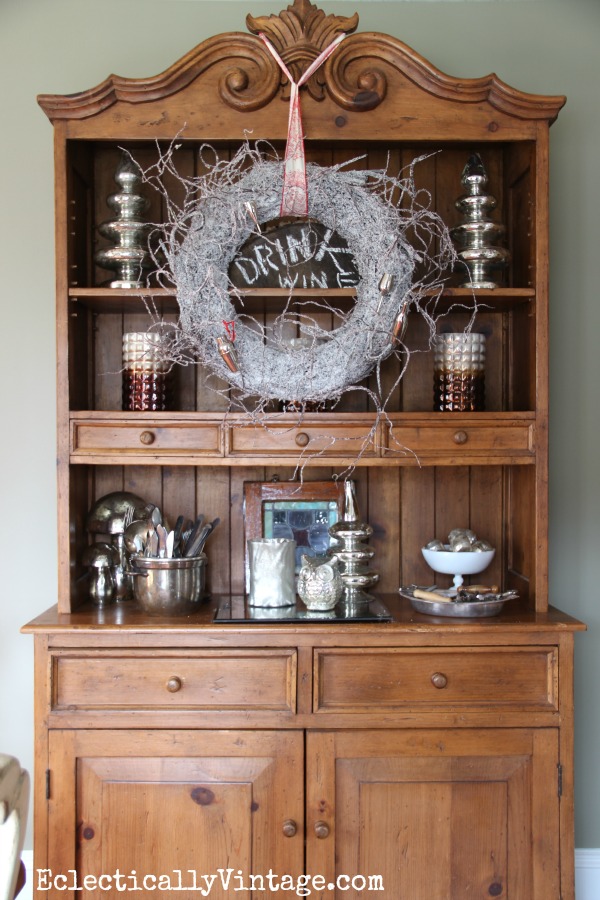 Christmas hutch decorations - love the wreath & mercury glass! kellyelko.com