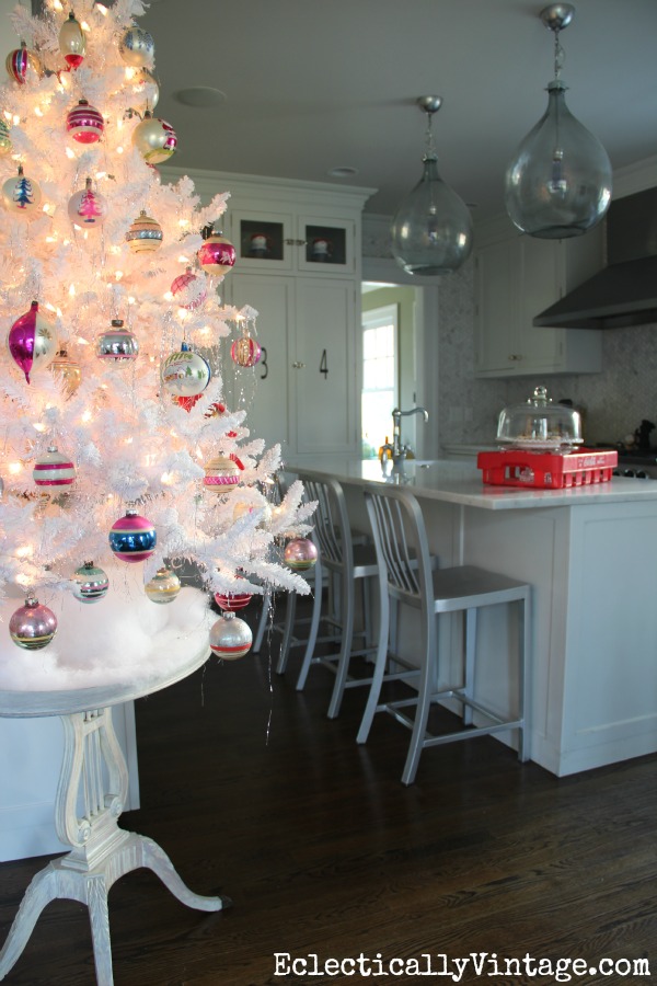 Fun flocked white Christmas tree in the kitchen! kellyelko.com