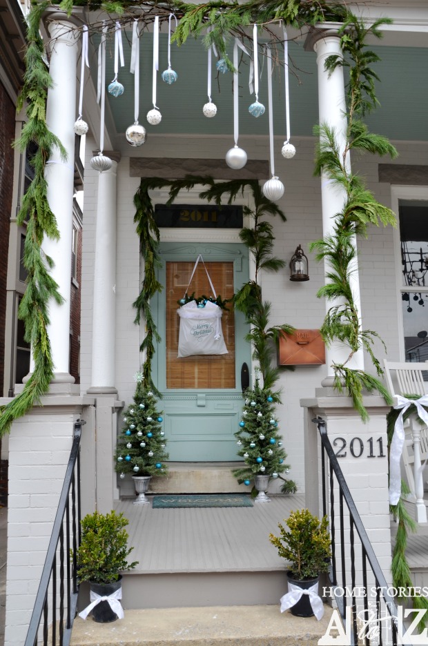 Christmas porch decorating ideas - love the hanging ornaments