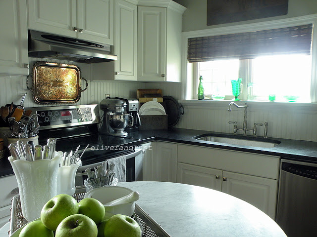 Gorgeous white kitchen with the coolest wine barrel island!