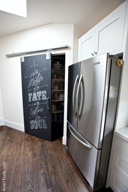 What a fun chalkboard rolling barn pantry door