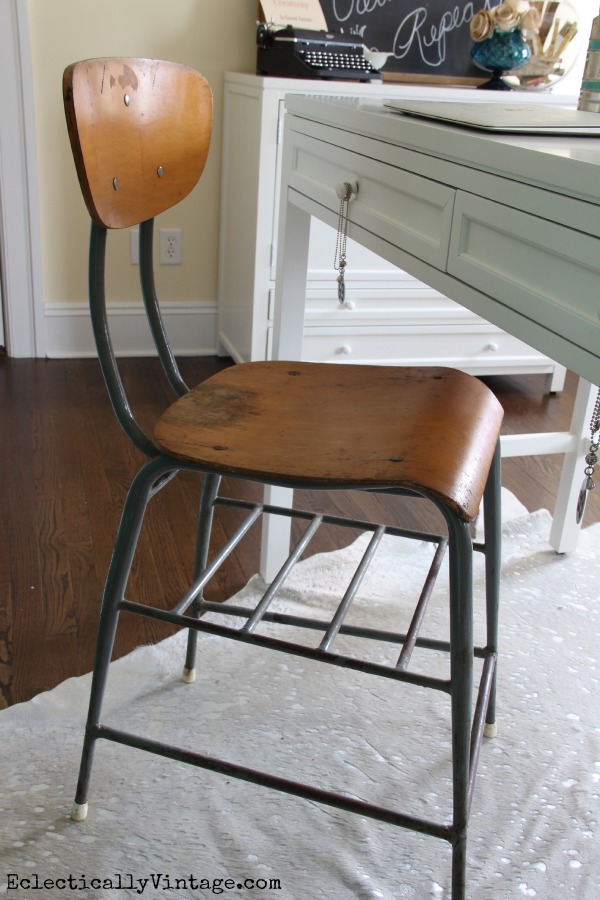 Love the industrial stool in this craft room - perfect mix of old and new! kellyelko.com