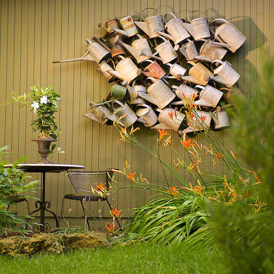 Watering can wall - very cool garden art! kellyelko.com