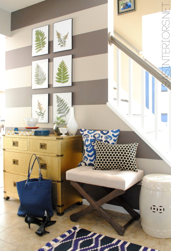 Striped wall foyer - love the gold chest of drawers kellyelko.com