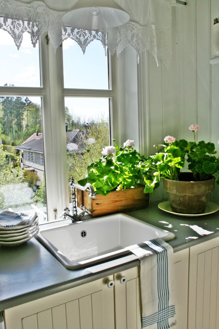 What a view from this farmhouse white kitchen kellyelko.com