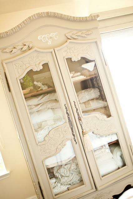 Love the glass panels on this armoire kellyelko.com