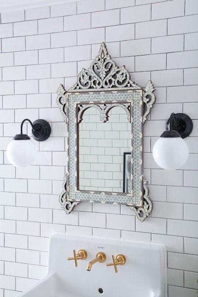 Love the wall of subway tile and the Moroccan mirror kellyelko.com