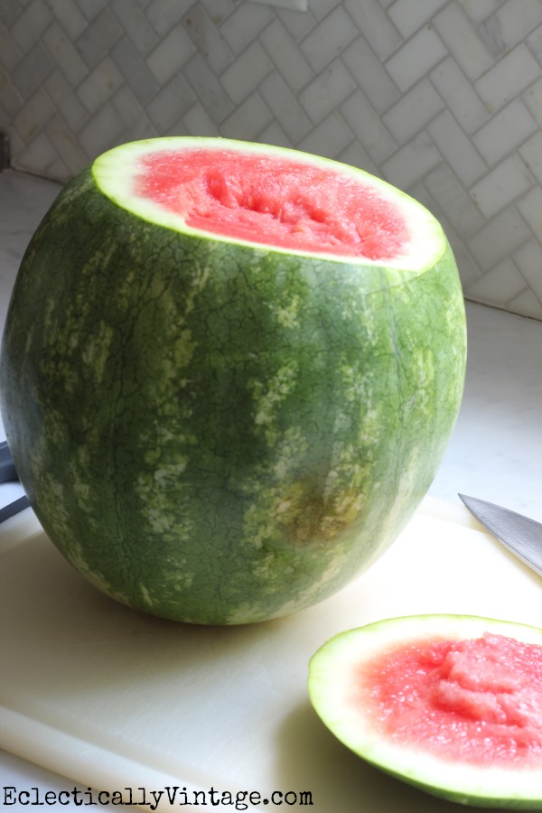 Make a watermelon cocktail dispenser kellyelko.com #summer #bbq #barbecue #recipes #cocktails #cocktailparty #summerrecipes #recipes #cocktailrecipe #watermelon 