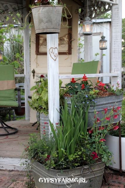 Gorgeous farmhouse garden tour - love the painted floor in the gazebo kellyelko.com